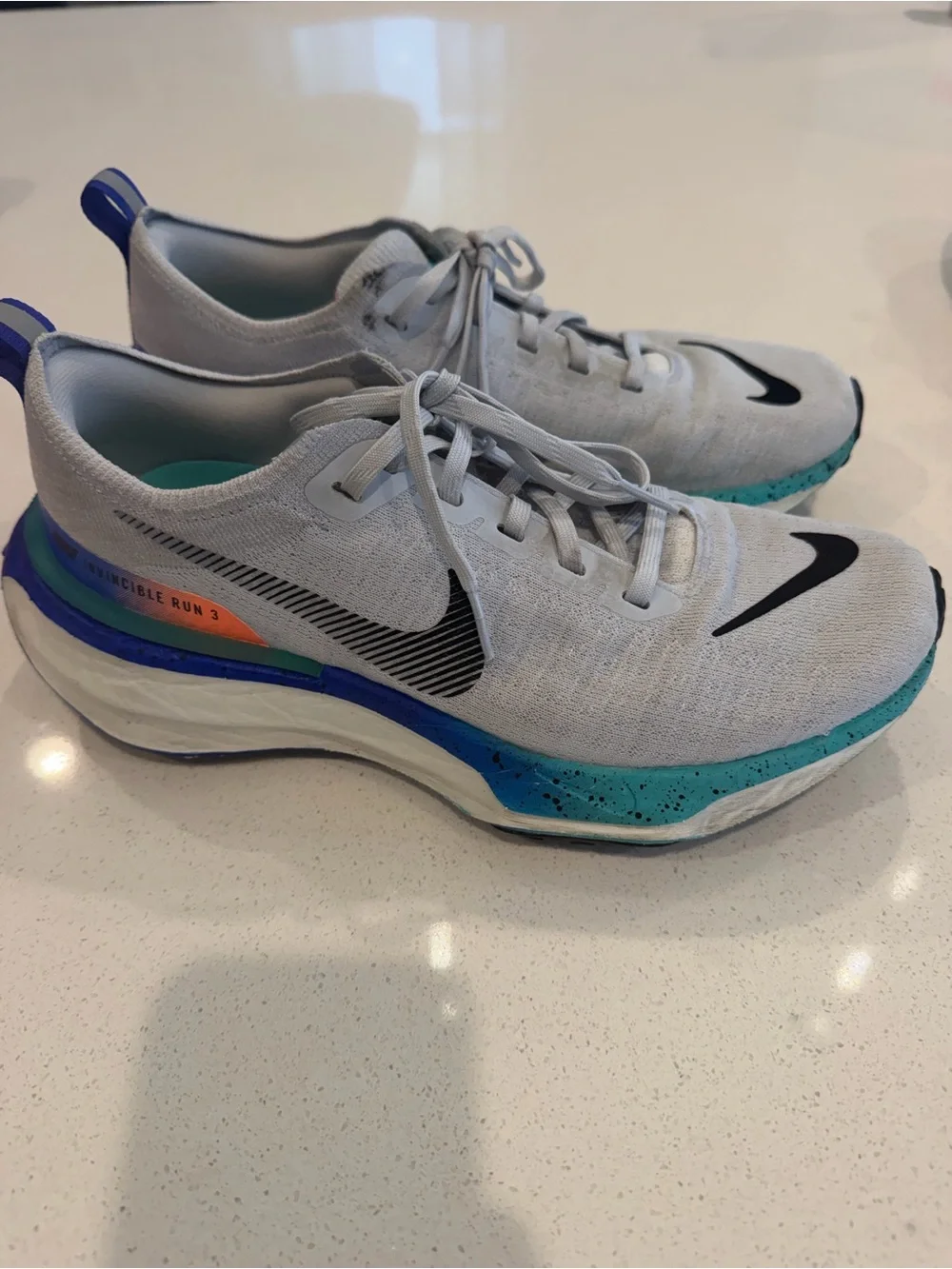 Nike Mens size 8 or Women’s 9.5 Grey ZoomX Invincible Sneakers with Blue Accents